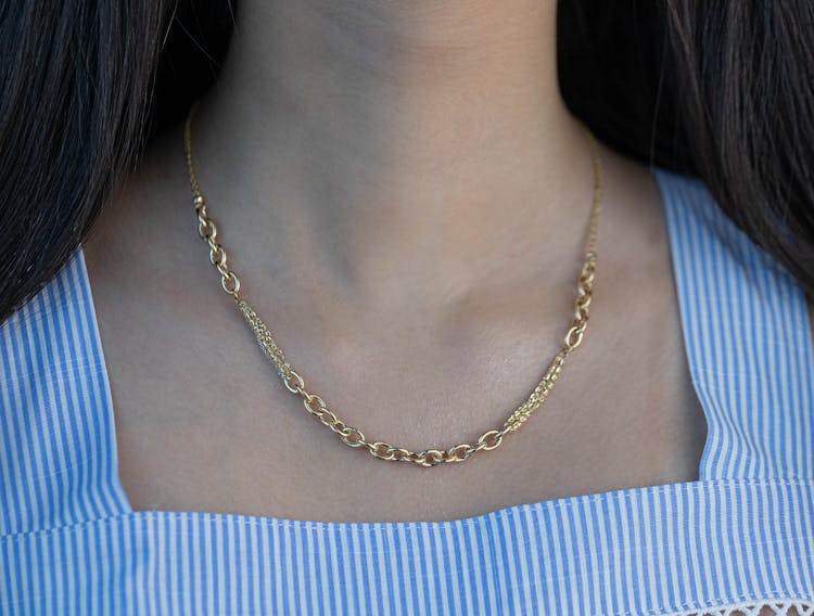 Close Up Of Woman With Golden Necklace