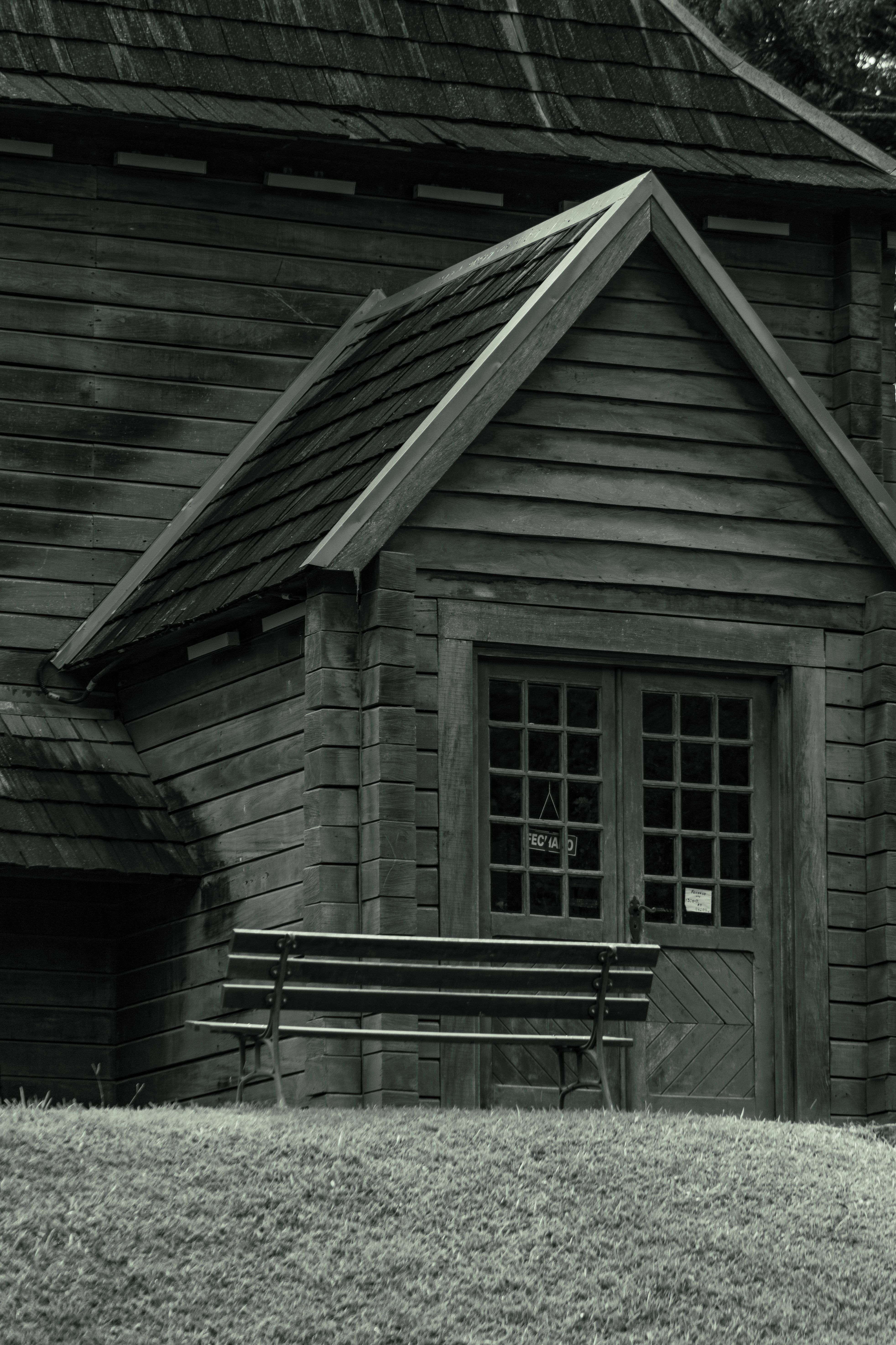 Bench in Front of Wooden Building · Free Stock Photo