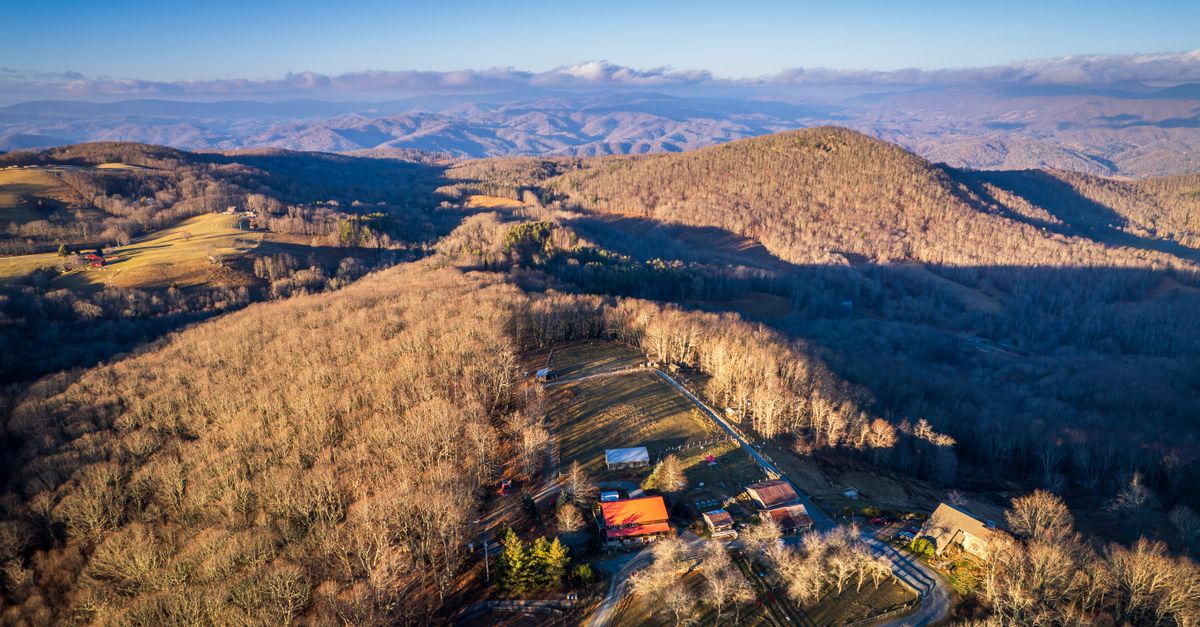 Aerial view of Banner Elk, NC showcasing picturesque mountains and rolling hills.