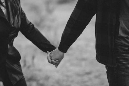 Hands of Couple Walking Together