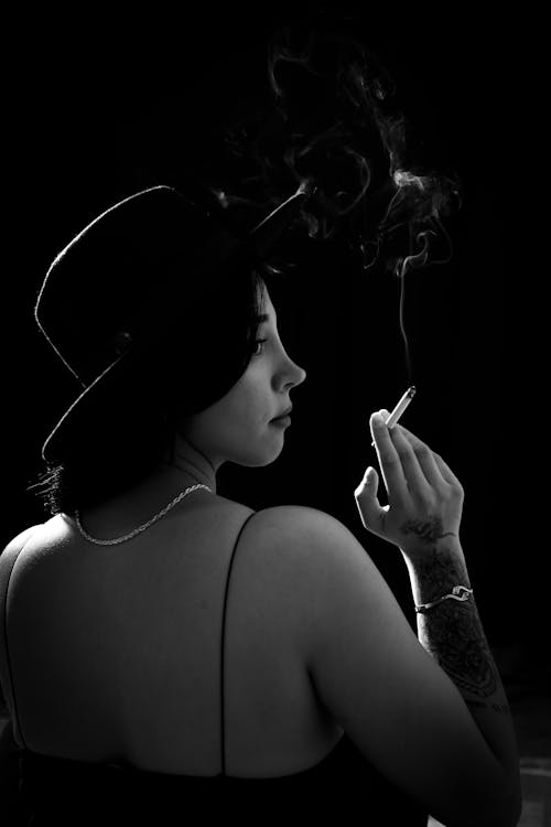 Woman in Hat and with Cigarette in Black and White