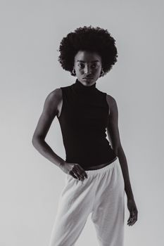 Stylish black and white portrait of a woman in casual modern fashion.