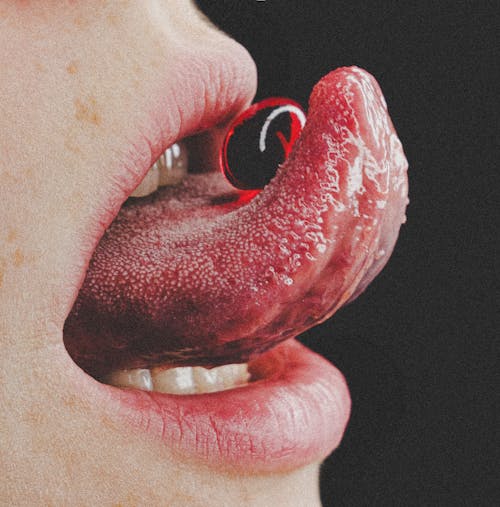 Close up of Candy on Woman Tongue