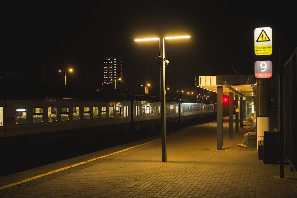 Train at the Station in City at Night 