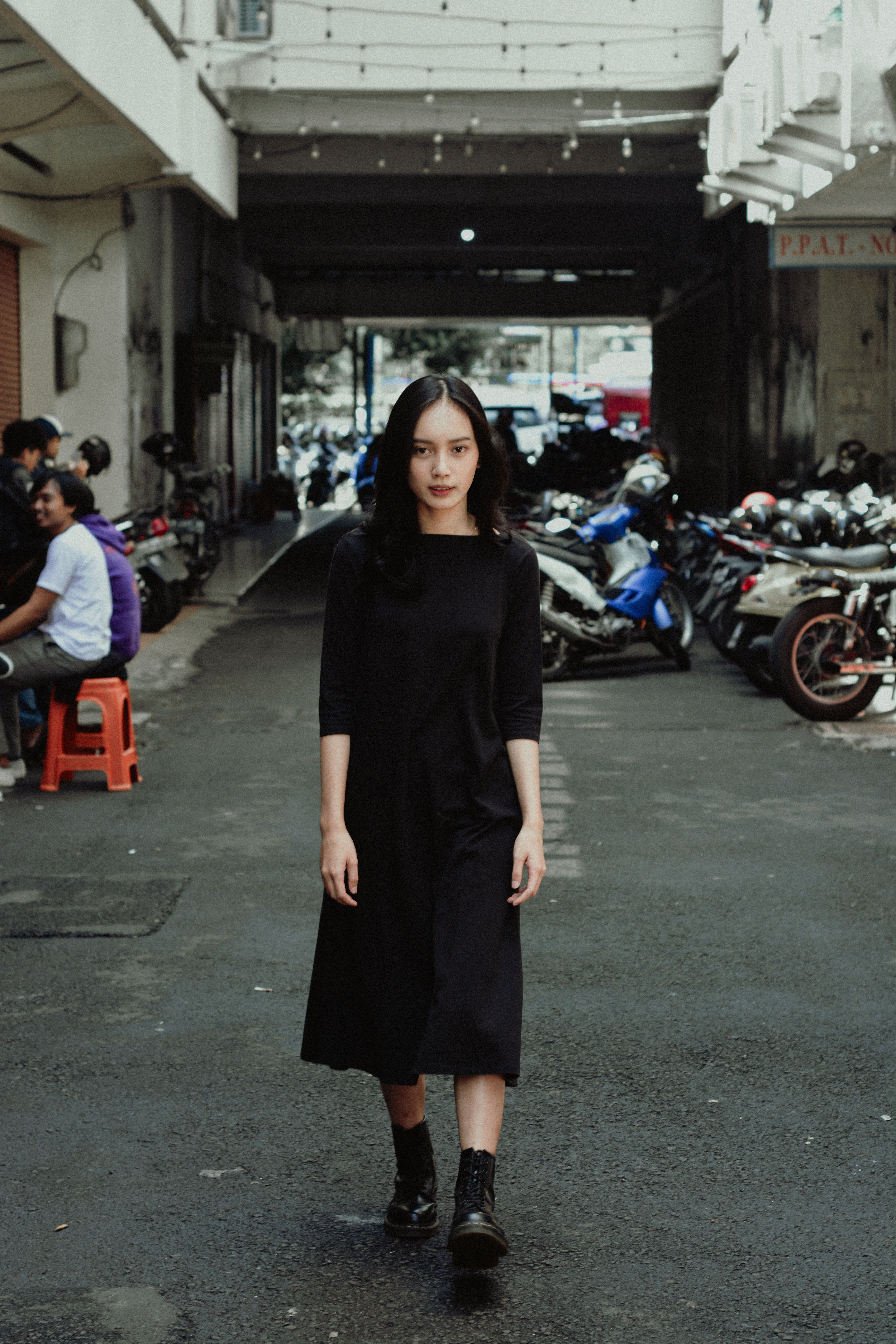 Woman in Black Dress Walking on Street · Free Stock Photo
