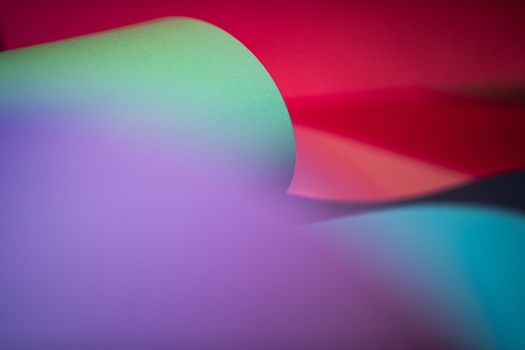 Colorful abstract design with curved paper and gradient hues in modern style.