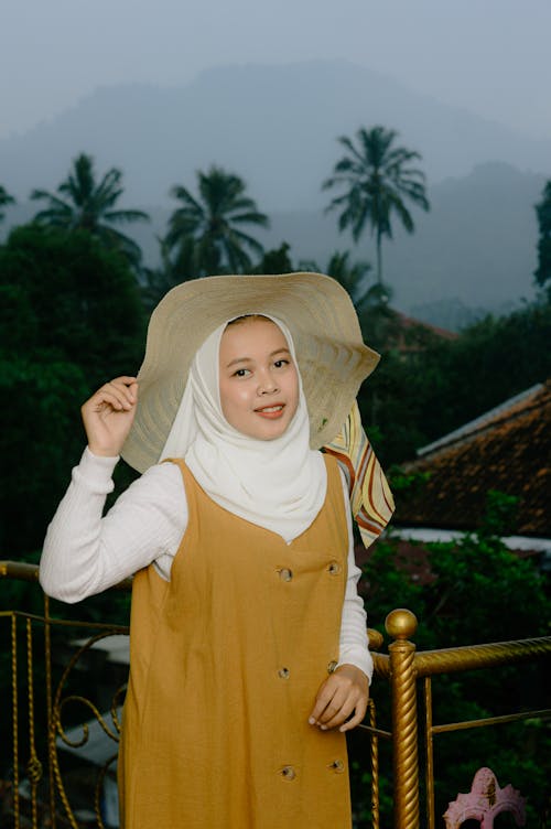 Smiling Woman in Hat and Hijab