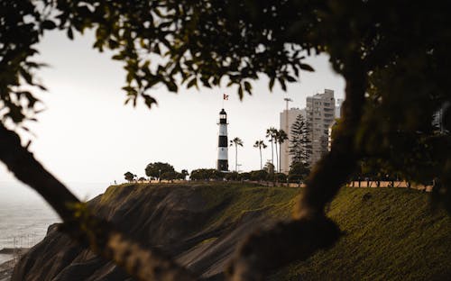 White Lighthouse Tower Beside Sea