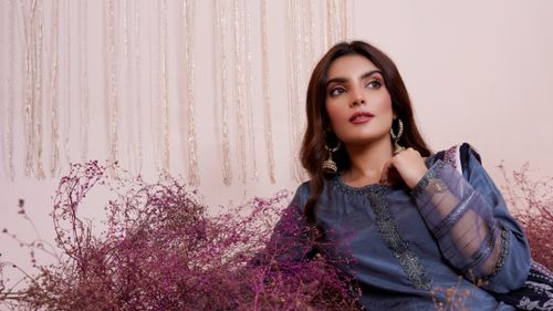 Free Stylish woman in embroidered dress with flowers, exuding elegance and traditional charm. Stock Photo