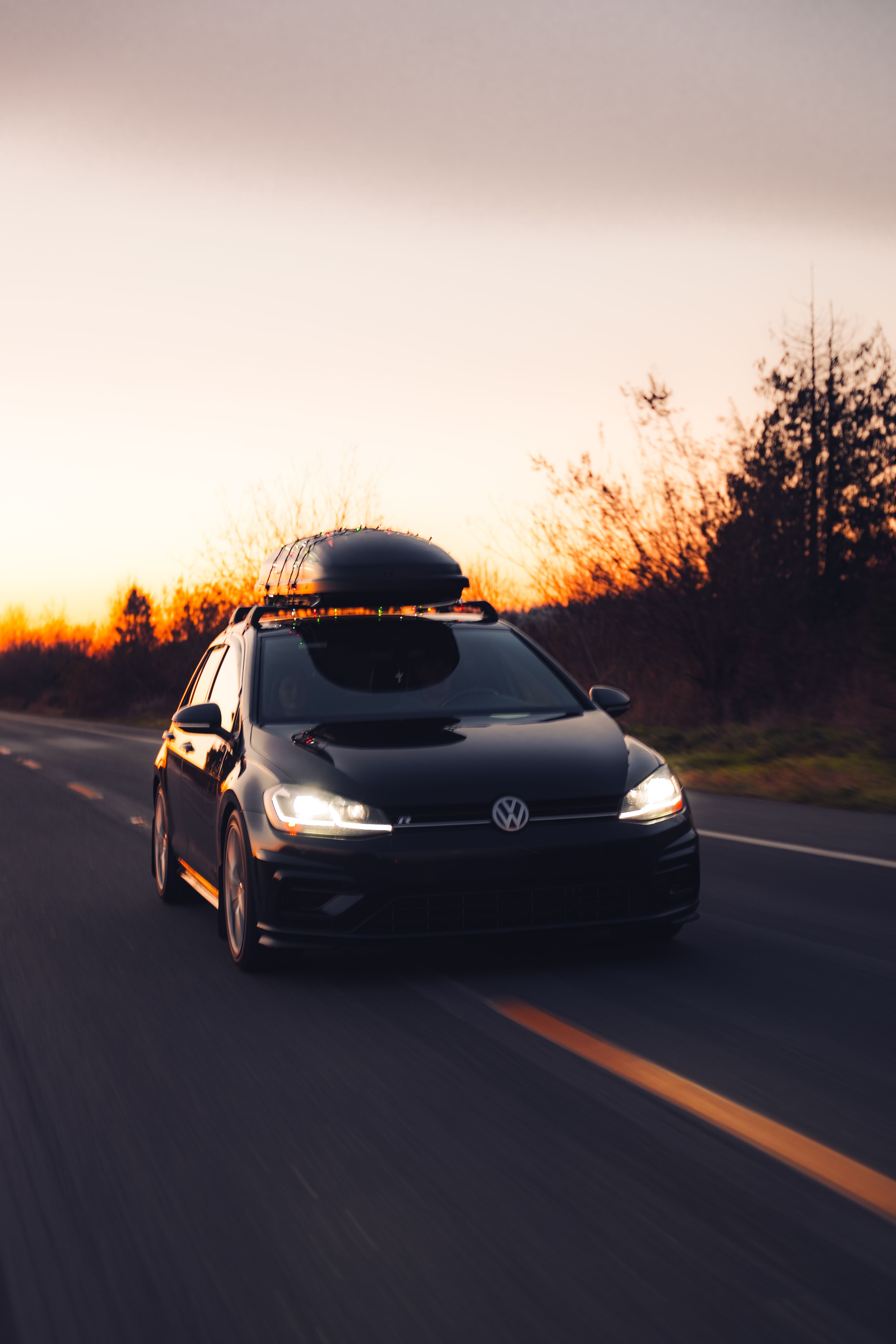 A Modern Volkswagen Car on the Street at Sunset · Free Stock Photo