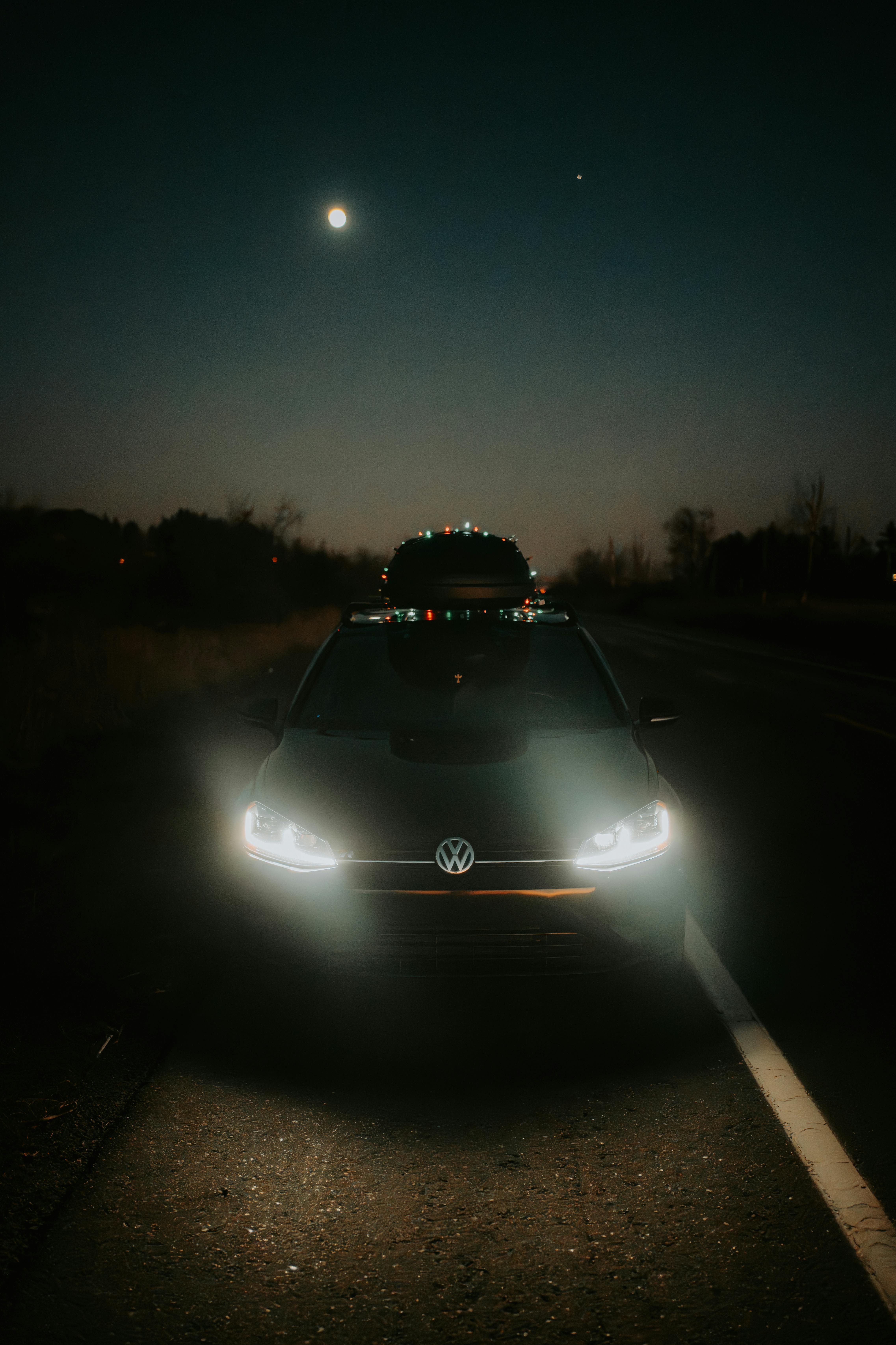 Black Car on a Road at Night · Free Stock Photo