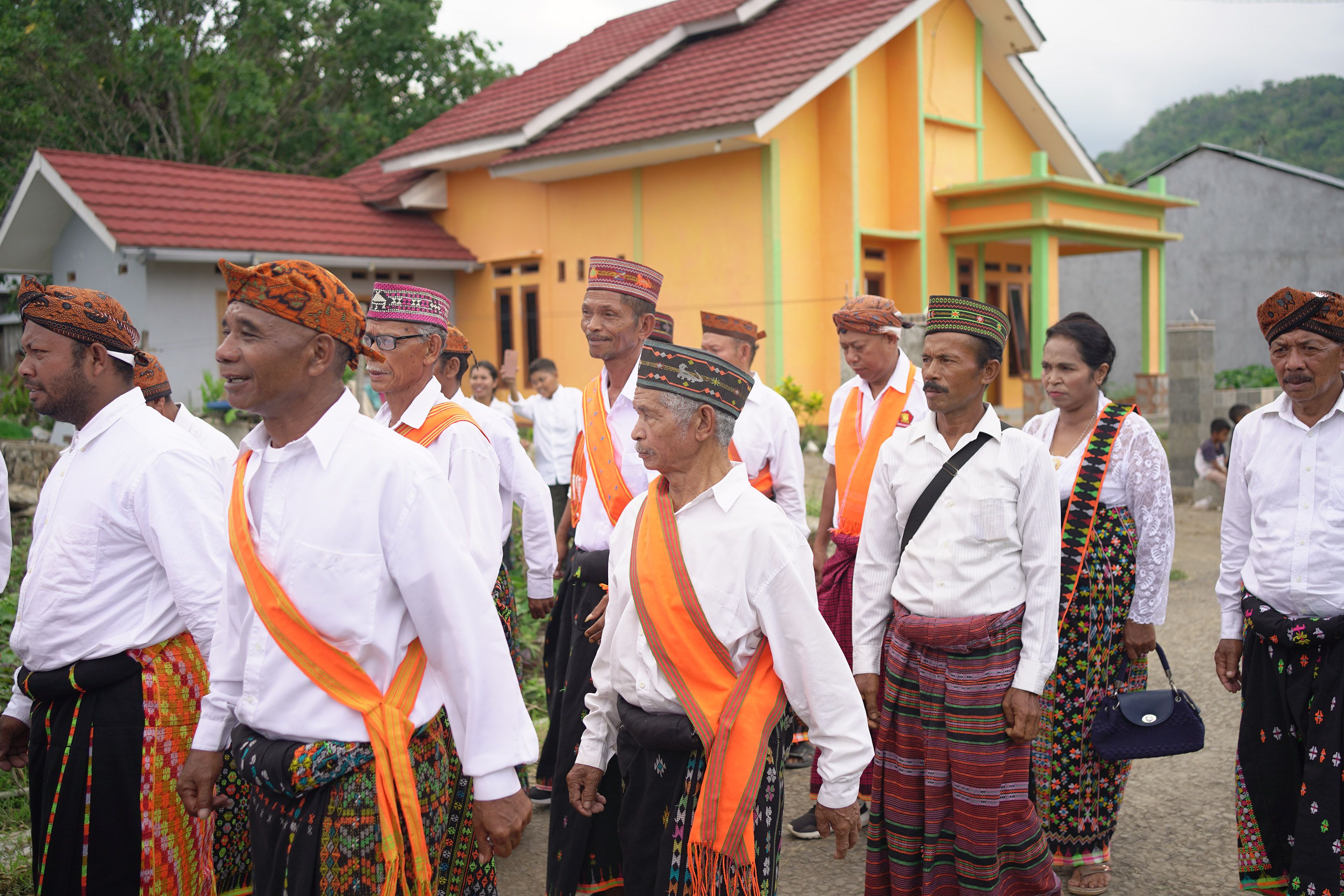 Indonesian villagers in traditional attire gather for a cultural ceremony in Badjo.