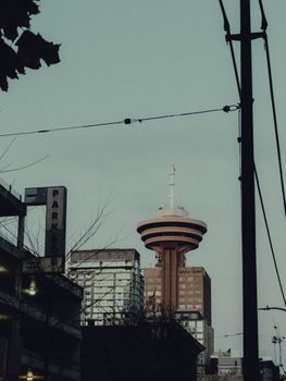 A striking view of the urban skyline in Vancouver, featuring the iconic tower set against the sky.