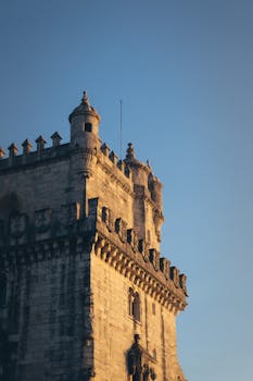 Belem Tower captured at sunset, showcasing its intricate architecture in Lisbon, Portugal.