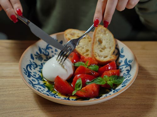 Free Egg with Tomatoes and Bread Served for Breakfast Stock Photo