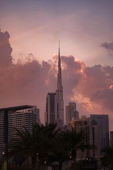 Captivating view of Burj Khalifa against a dramatic twilight sky in Dubai, UAE.