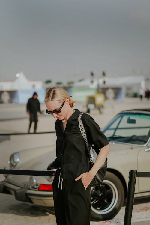 Blonde Woman in Black Shirt and Sunglasses