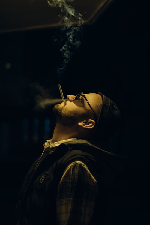 Man Smoking a Cigarette at Night 
