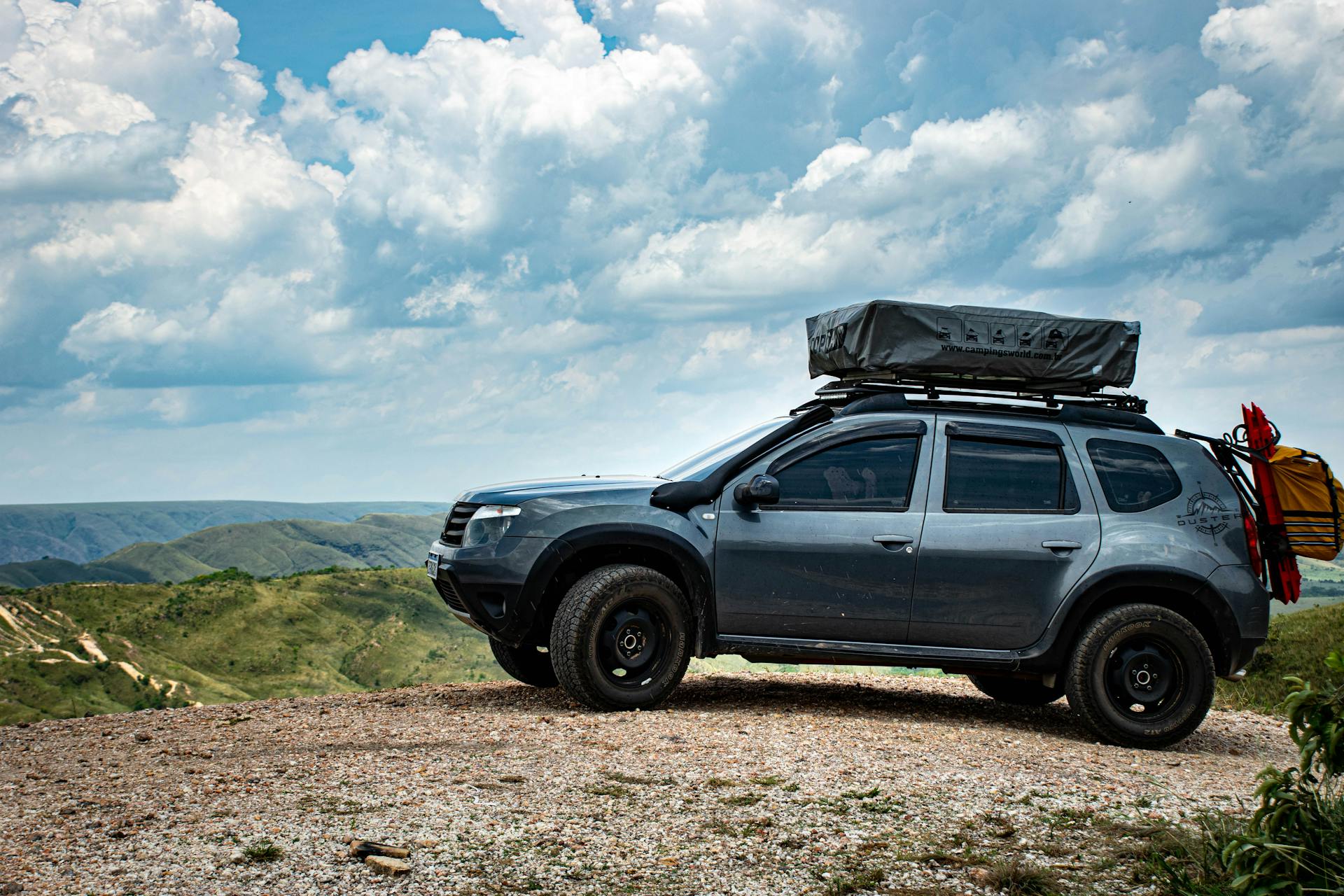 SUV with Roof Tent on Hill