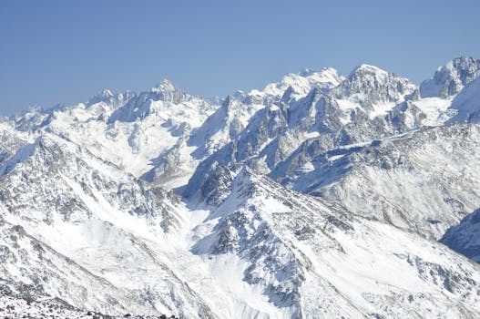 A breathtaking view of snow-covered mountains in the Caucasus region during winter.
