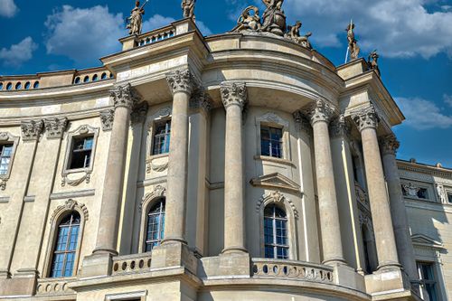 Free A striking view of the ornate baroque facade of Berlin's historic library under a clear blue sky. Stock Photo