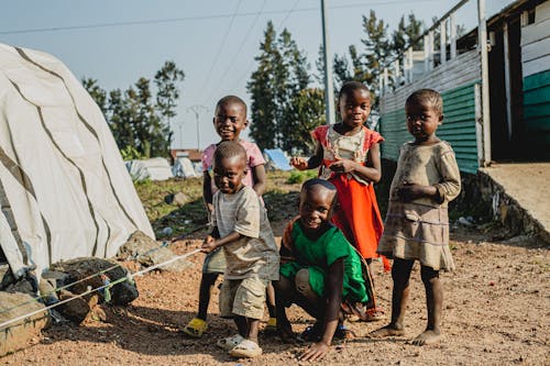 Smiling Boys and Girl in Village