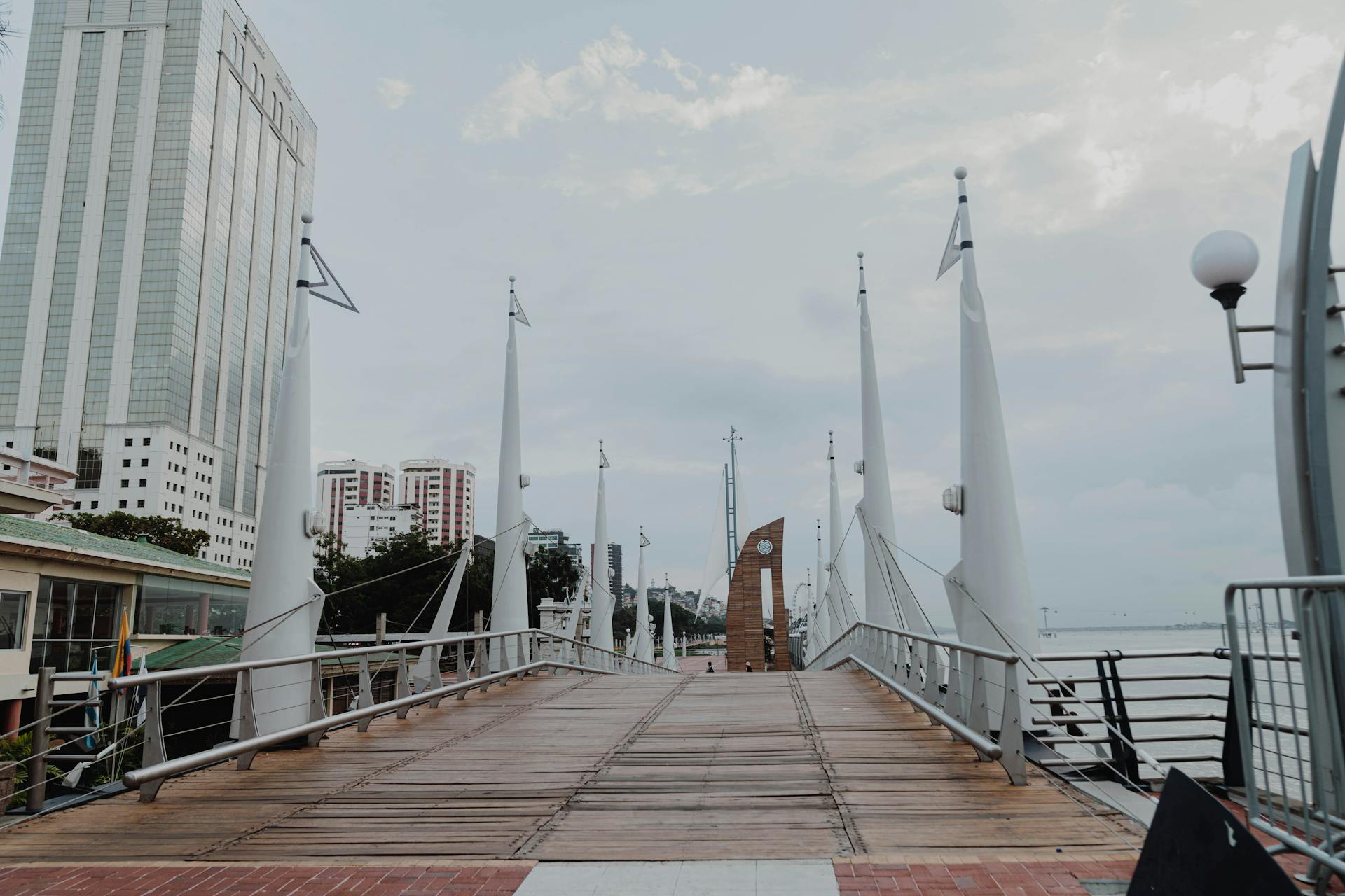 Explore the contemporary footbridge in Guayaquil with stunning cityscape views and river backdrop.