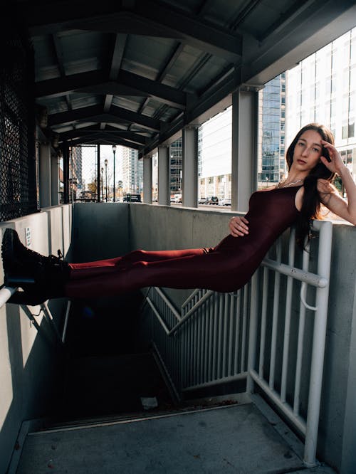 fashion model posing in subway entrance 