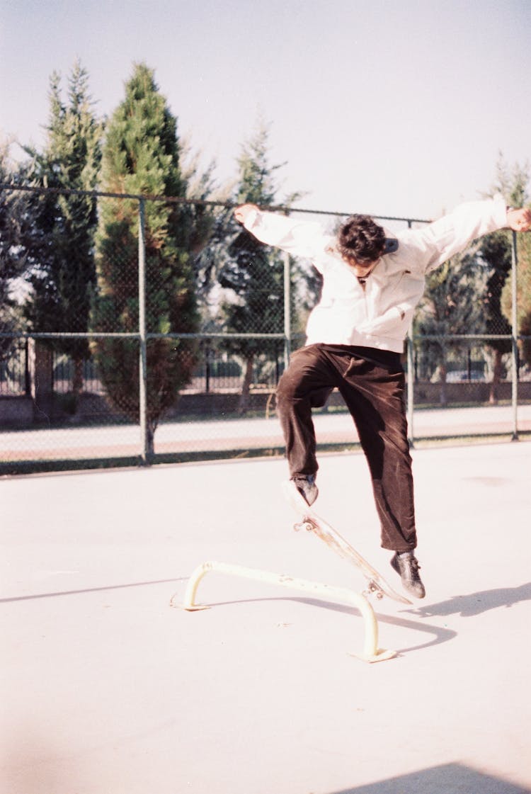 Young Man Doing A Trick On A Skateboard 