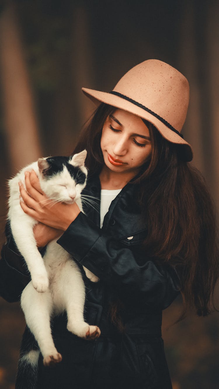 Young Woman Holding A Cat