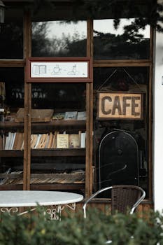 Charming rustic cafe facade in Talas, Türkiye, featuring a book display and inviting cafe sign.