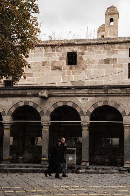 People Walking by a Building · Free Stock Photo