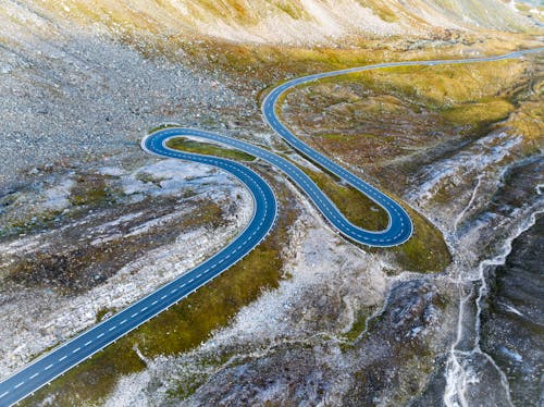 Turns on Road in Valley in Mountains