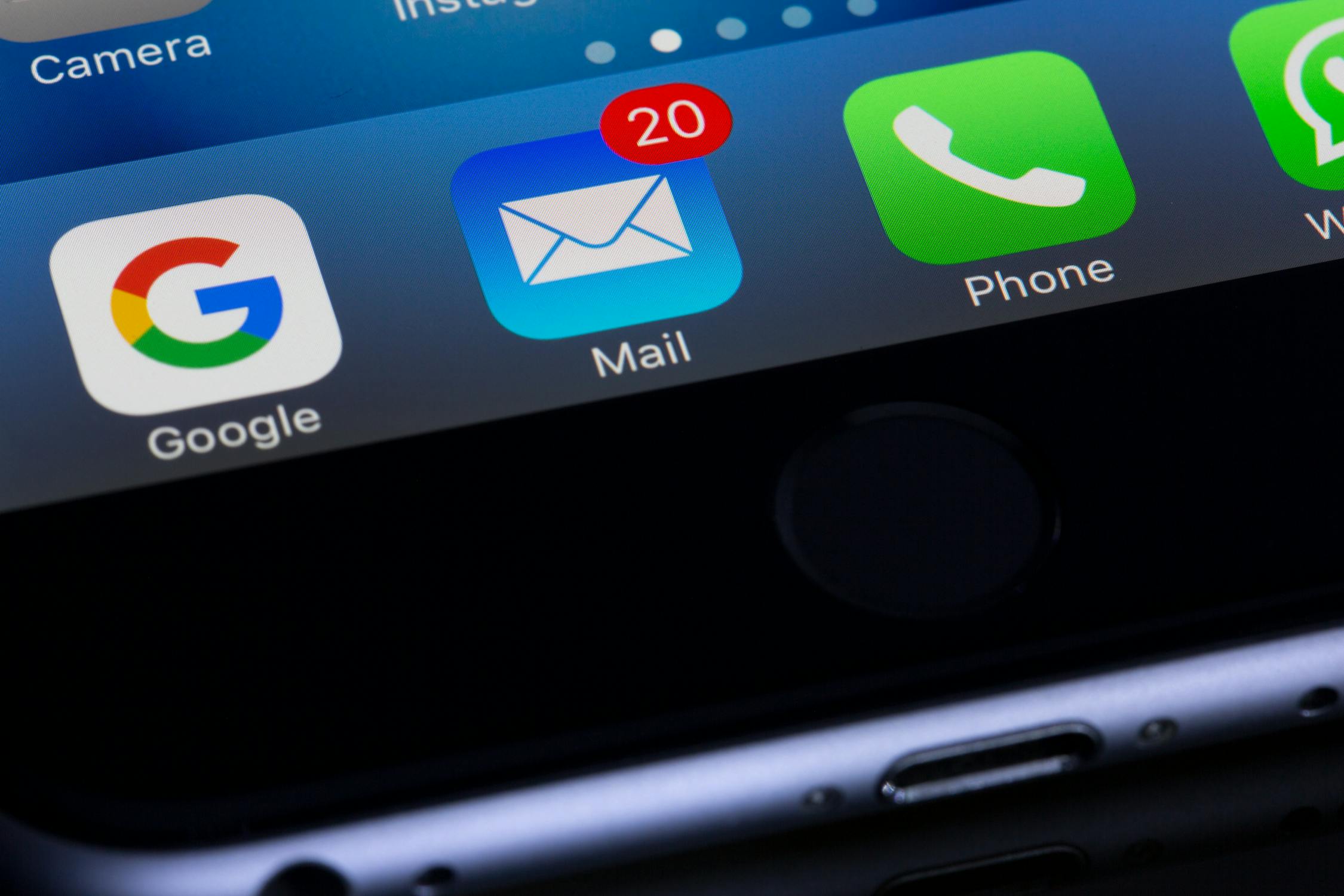 Close up of mail symbol on cell phone with 20 notifications for new emails