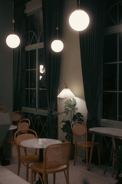 Lamps over Chairs and Tables in Restaurant