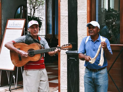 Two Men Performing in a City 