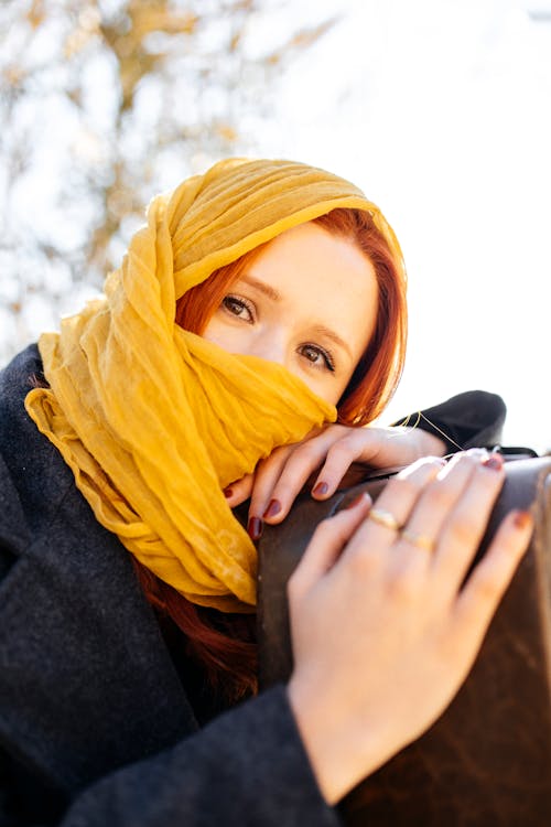 Portrait of a Redhead Woman Wearing a Yellow Scarf