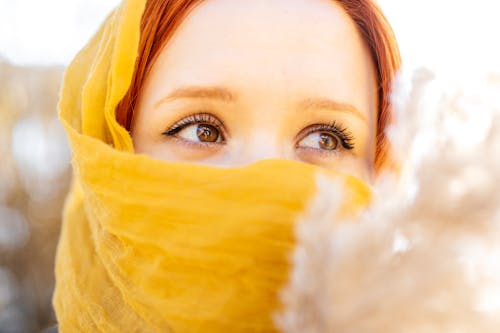 Close-up of Young Woman Wearing a Yellow Scarf