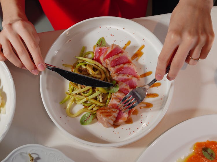 Top View Of A Woman Eating A Meal