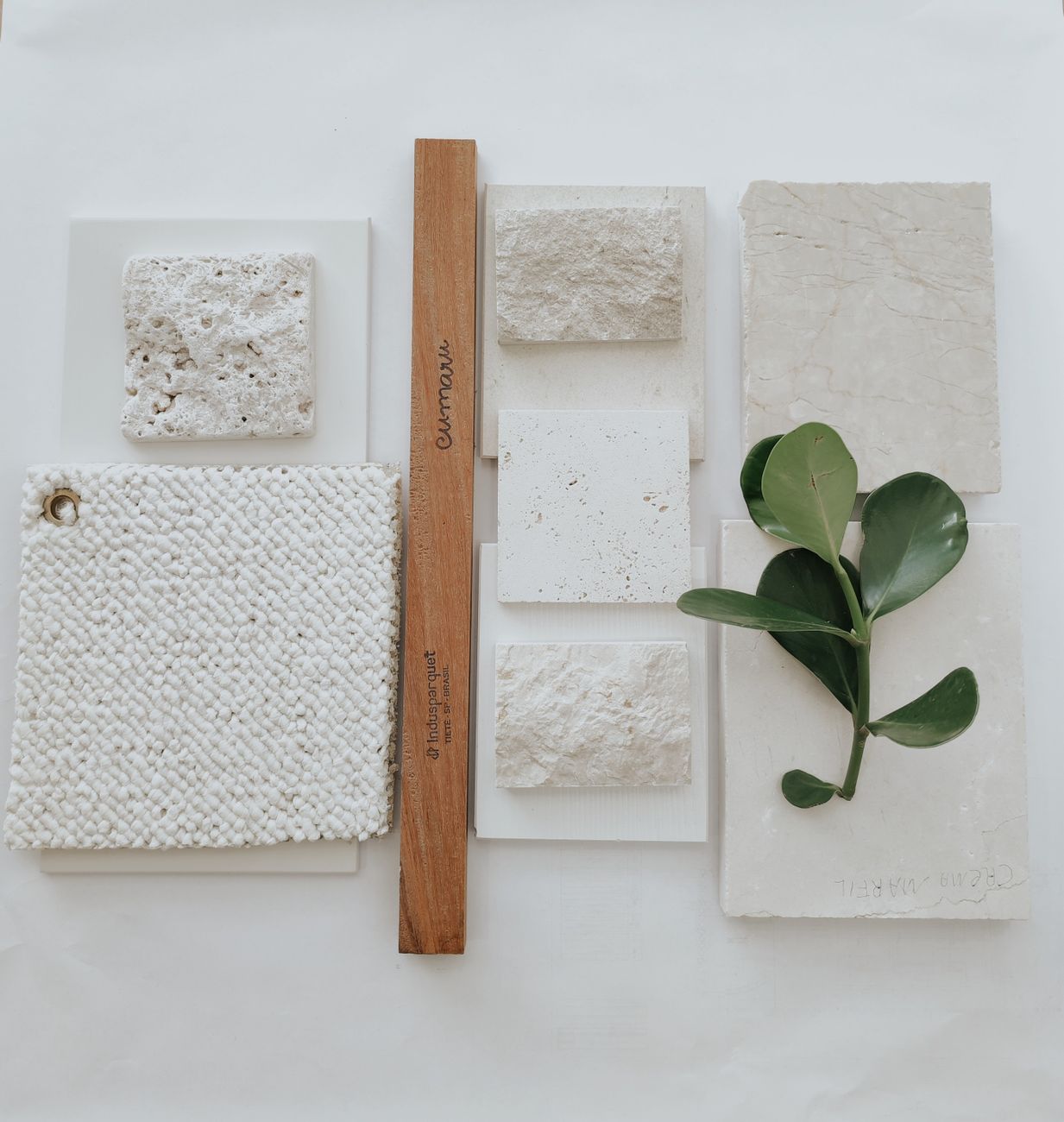 Textured stone samples and a measuring rule, a reminder that renovation calm still sits on top of budgets and real constraints