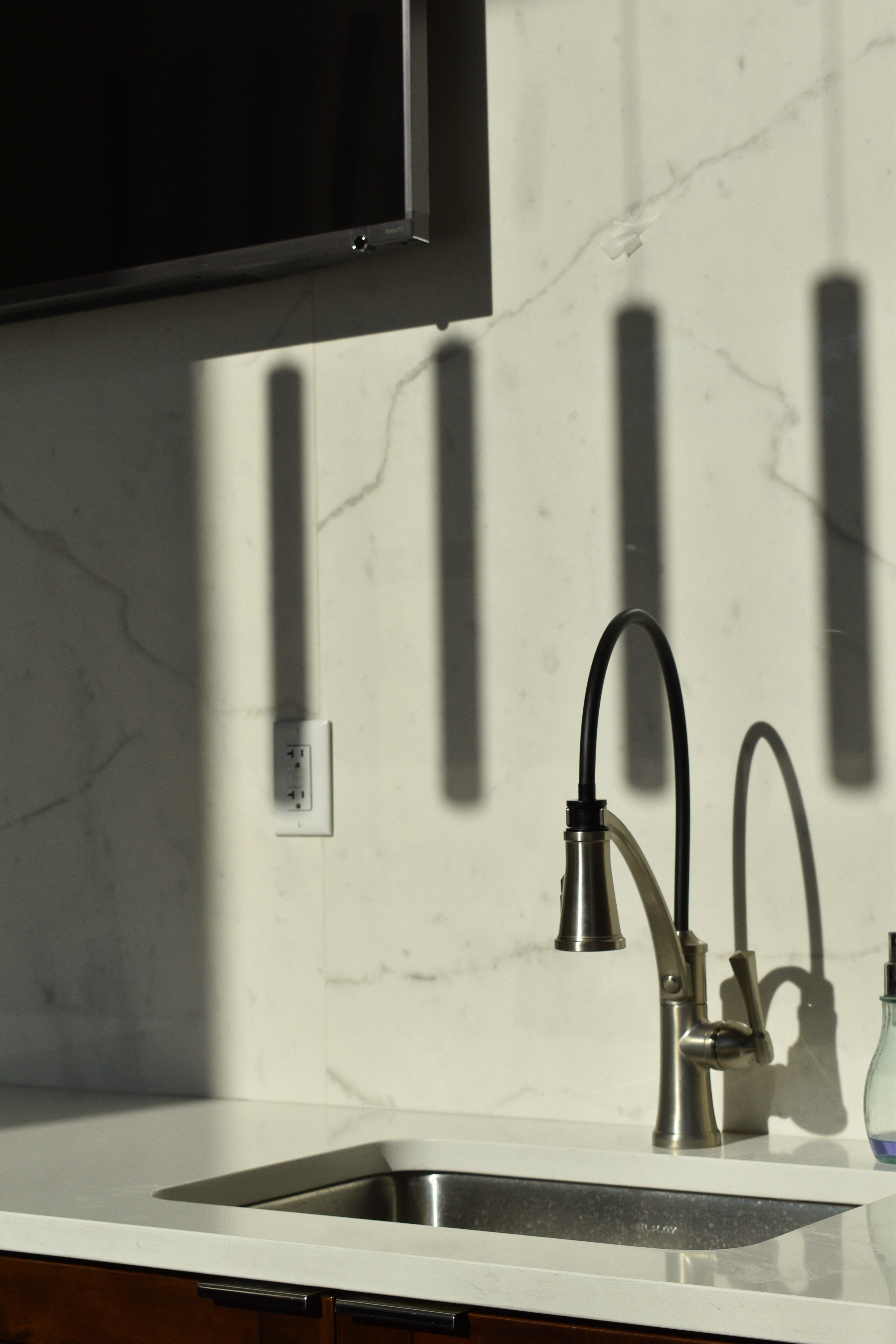 Modern kitchen sink with faucet and soap dispenser