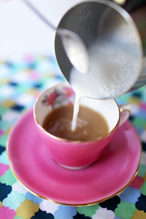 Free Liquid Pouring from Teapot Stock Photo