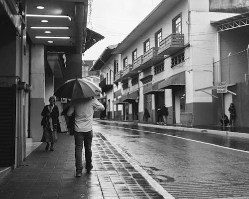 Pedestrians in City in Rain