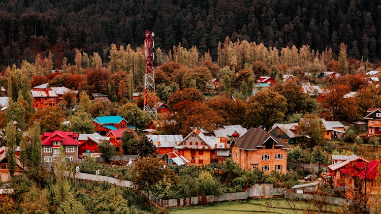 Relay Tower In The Middle Of The Village To A Hill By The Forest