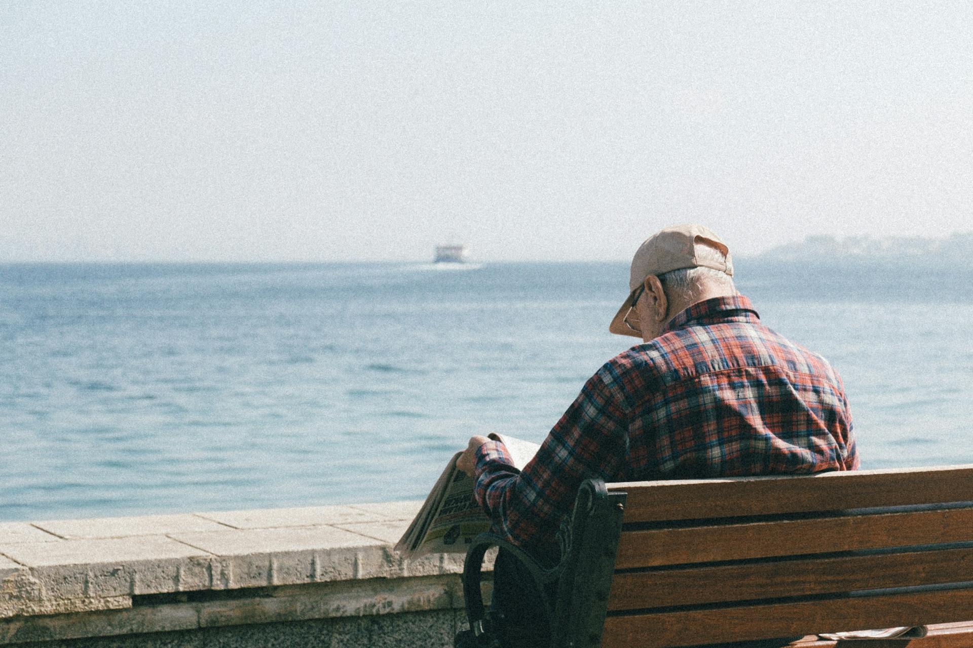 Retiree Reading Newspaper in Seaside