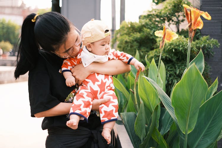 Baby Touching Flower