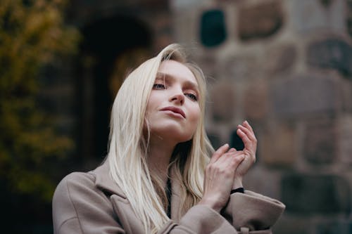 Blonde Woman with Hands Clasped