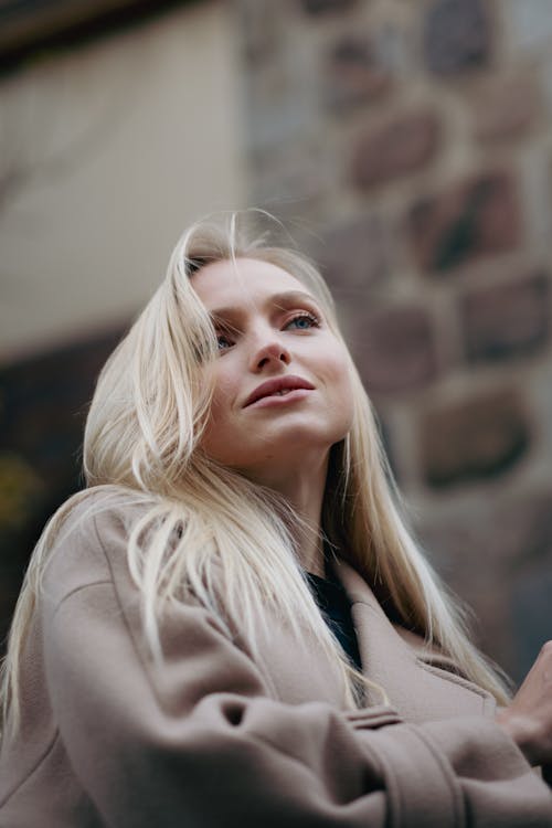 Portrait of a Blonde Standing Outdoors