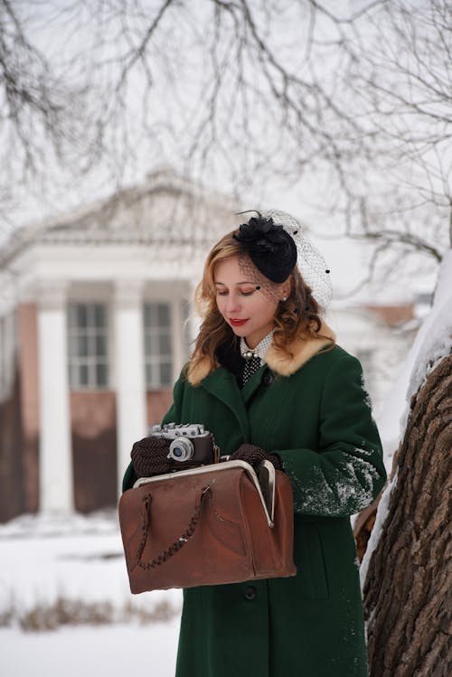 Woman in Green Coat and with Bag