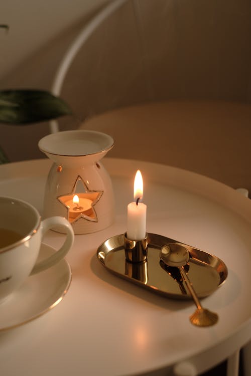 Candle on a Tray and a Cup of Tea 